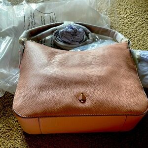 Never used brand new still in bag and excellent condition Kate Spade bag